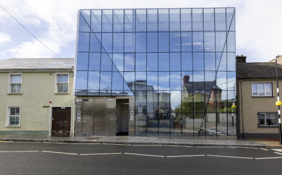 The glass front of the cube building