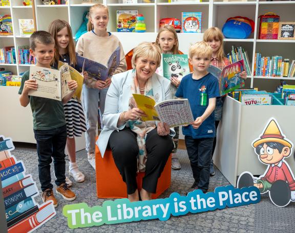 Kids reading in the new library