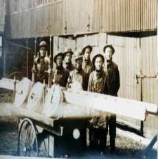 Image shows workers of the ladder and bucket brigade