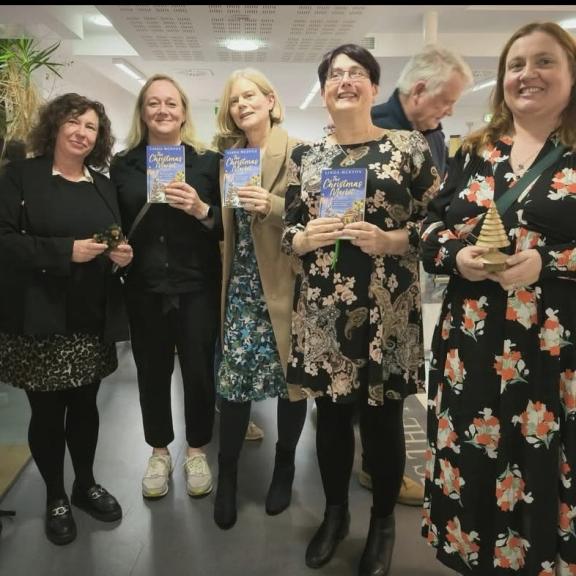 Library staff with author at book launch