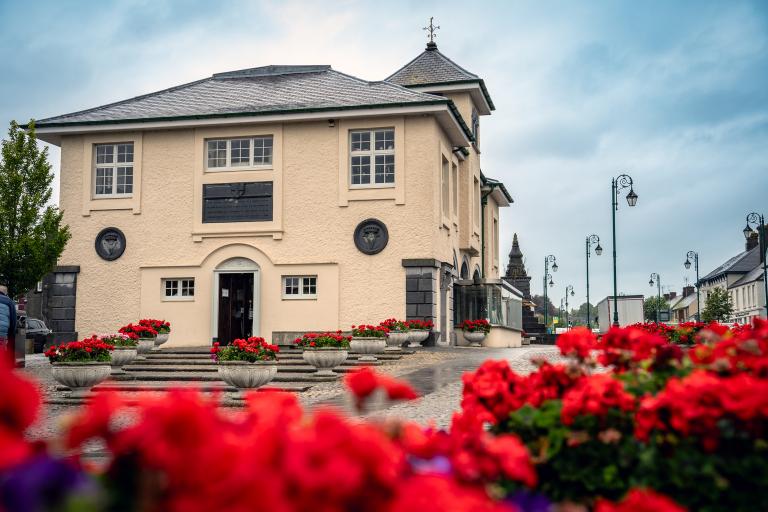 Abbeyleix library with red flowers in the foreground.