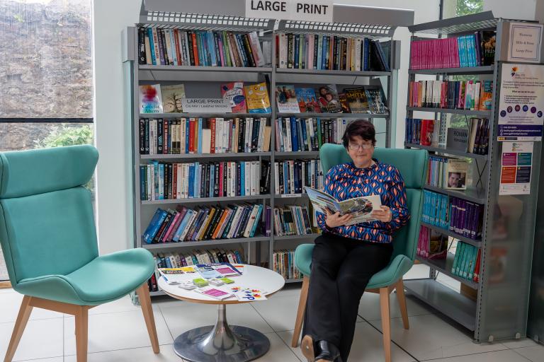 Woman reading in library