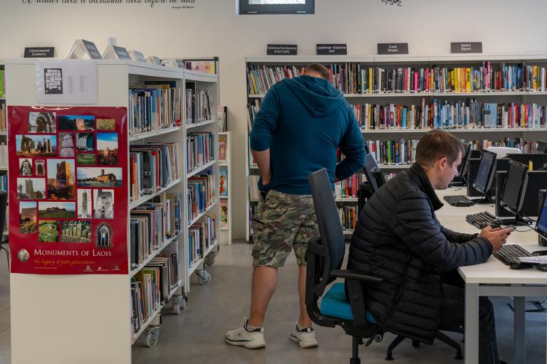 Man browsing library shelves