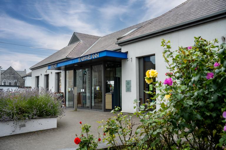 Portarlington Library building with flowers in the foreground. 