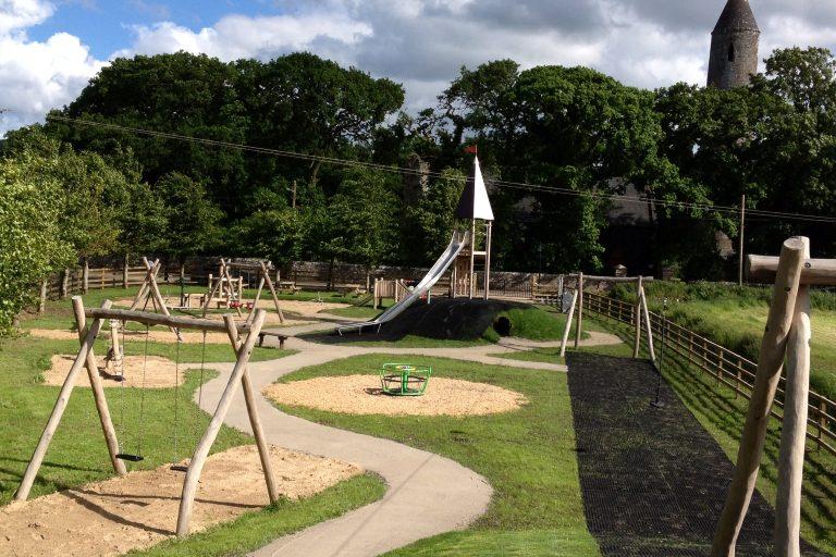 swings and slide at the timahoe playground