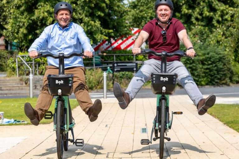 local councillor riding a bolt bike at the official launch day