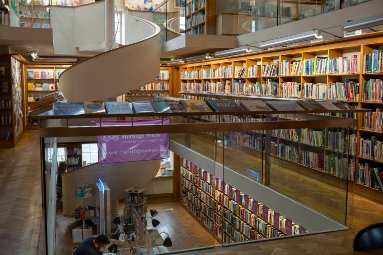 Main library area with Heritage Week flag