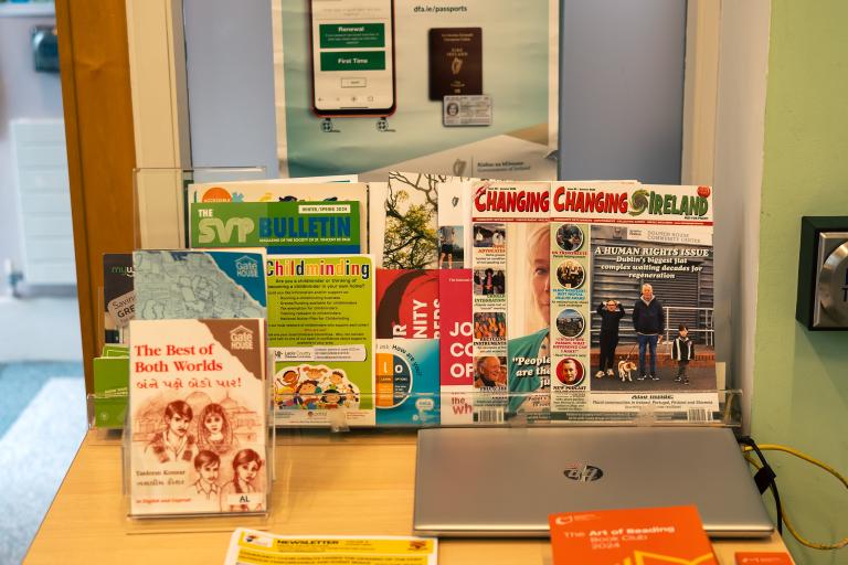 Laptop and information leaflets in library