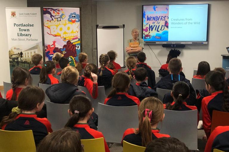 Children listening to author at the library