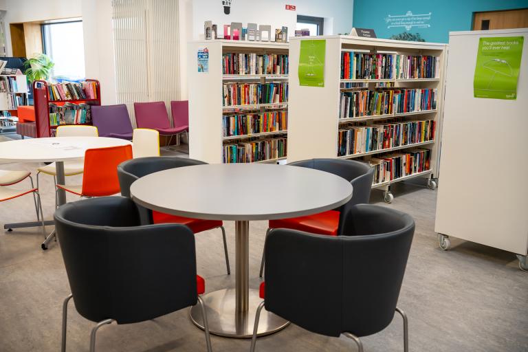 Tables and chairs in library 