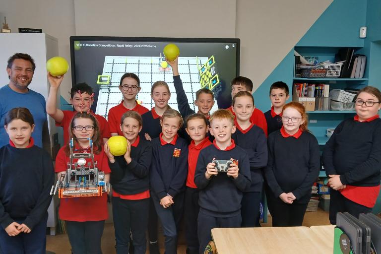 Pike of Rushall National school students with Seanie Morris and his robot Swish