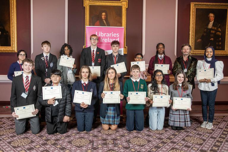 Group of students with certificates of participation