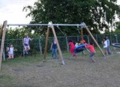 children on swings in durrow playground