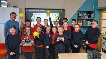 Pike of Rushall National school students with Seanie Morris and his robot Swish