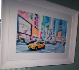 Picture of yellow taxi on busy street