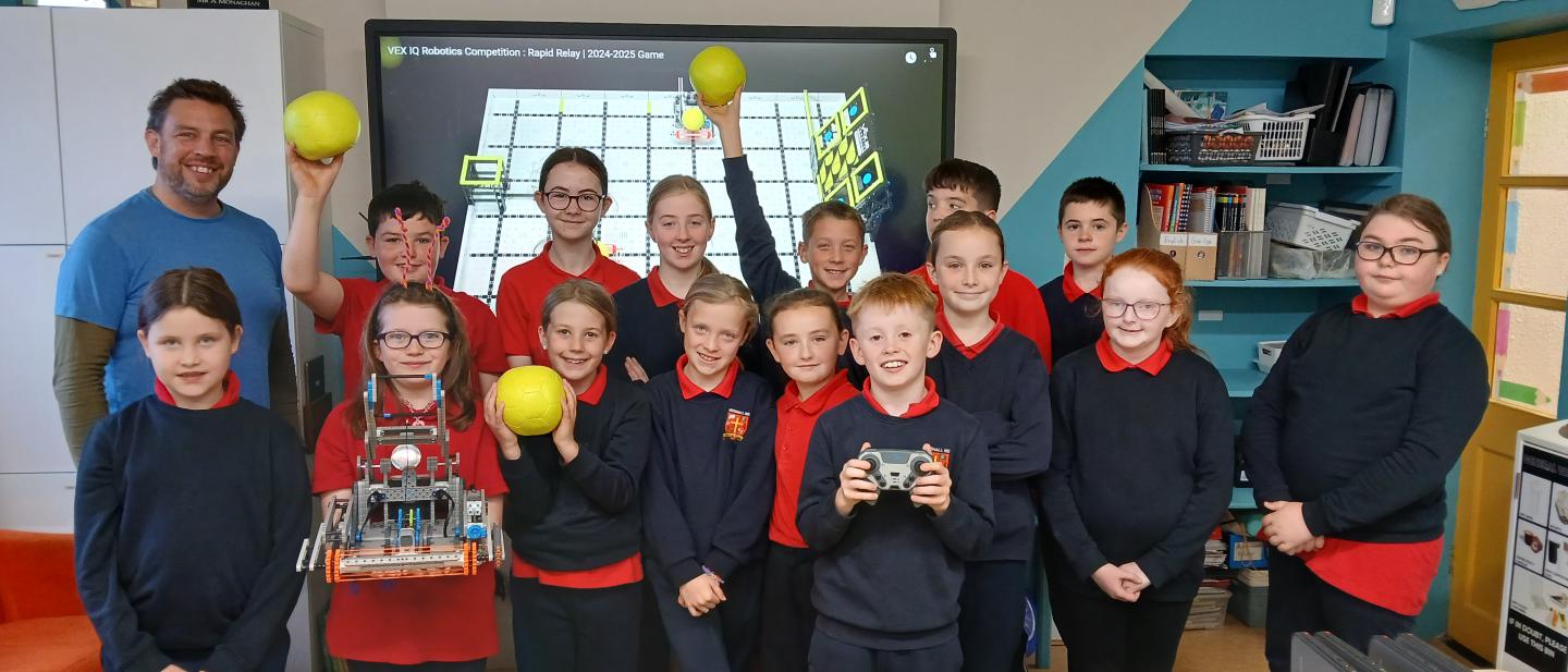 Pike of Rushall National school students with Seanie Morris and his robot Swish